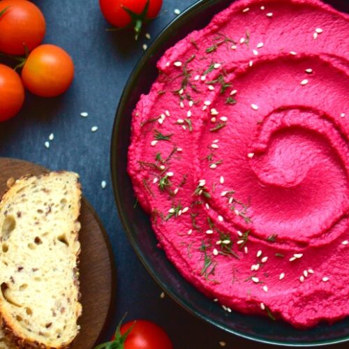 Roasted beetroot hummus served with bread and cherry tomatoes