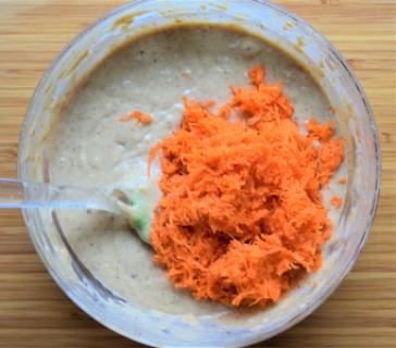 Add grated carrots to the cake batter