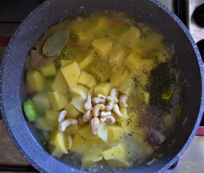 Potato leek soup ingredients into a pot