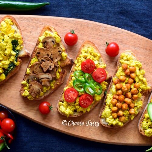 Tofu scramble served on toast with veggies and toppings