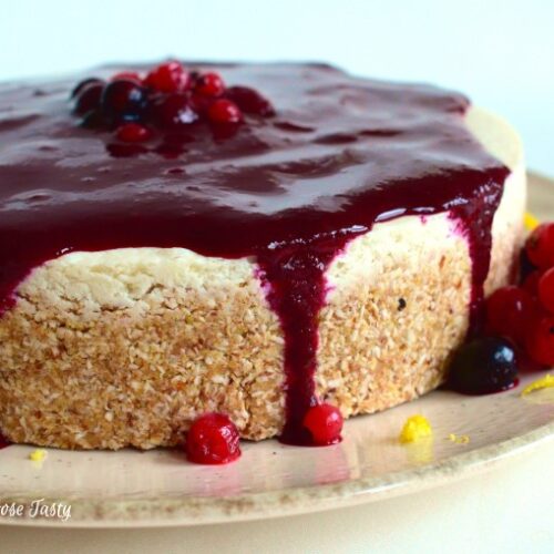Vegan cheesecake topped with berry sauce