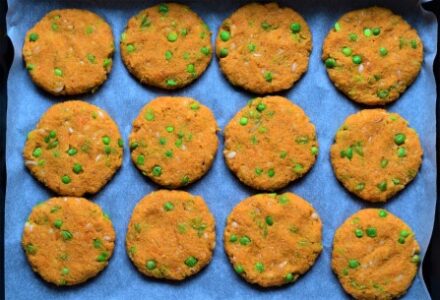 Sweet potato and green pea patties in a baking tray