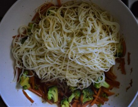 Chow mein noodles preparation with broccoli and carrots