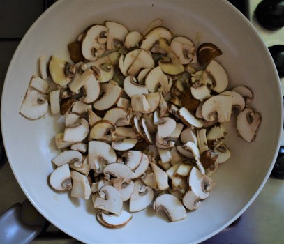 Mushrooms cooked in a wok with garlic and onion