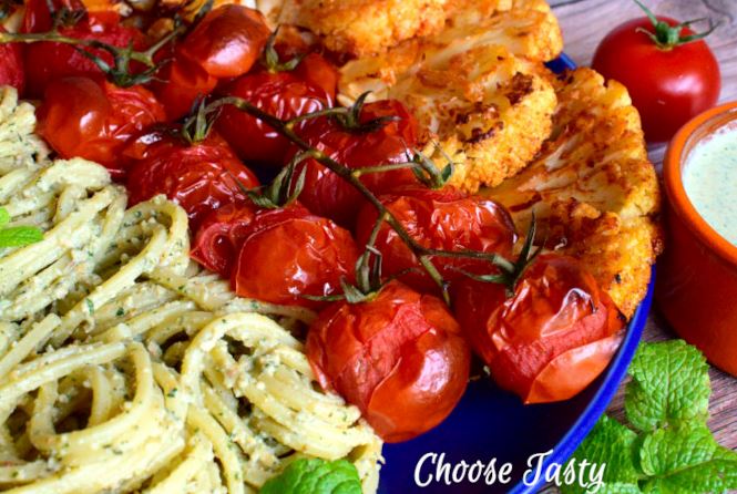 Mint pumpkin seeds pasta with cauliflower steaks and roasted cherry tomatoes